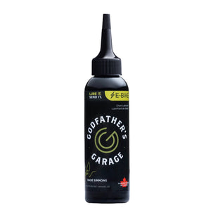 Bottle of Godfather's Garage e-bike chain lube on a white background